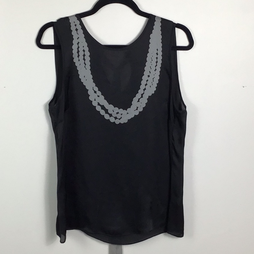 Black silk sleeveless top with printed necklace and grosgrain tie back